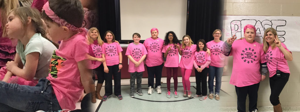 Student and Staff showing off their pink shirts and hair for pink day